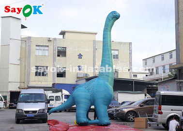 Dinosauro gonfiabile di Natale 7m H Modello gigante di dinosauro gonfiabile con soffiatore d'aria per l'esposizione